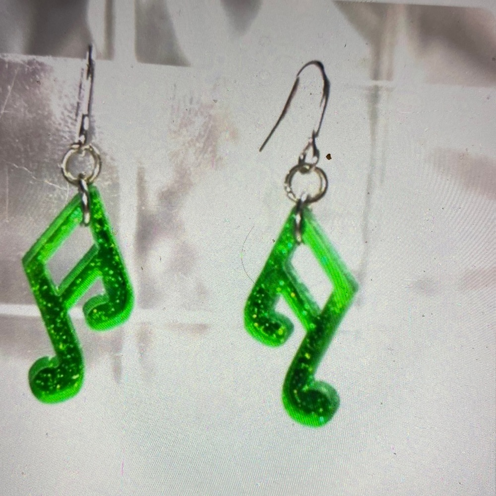 Mirrored music, notes, earrings, festival, concerts, band members.